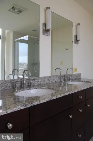 a bathroom with a sink a shower and a bathtub