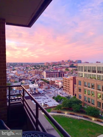 a view of an empty room with windows