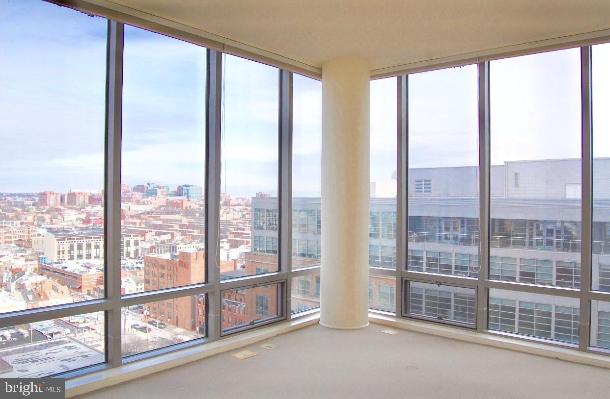 675 President Street, Unit 1609 Baltimore, MD 21202 - Photo 8 of 13 a view of an empty room with windows