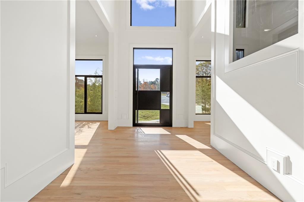 520 Heathmill Court Milton, GA 30004 - Photo 17 of 84 a view of a hallway with wooden floor and staircase
