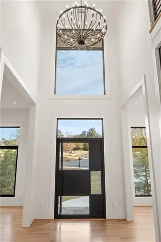 a view of livingroom with furniture wooden floor and chandelier