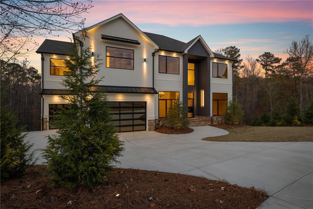 520 Heathmill Court Milton, GA 30004 - Photo 2 of 84 a front view of a house with a yard and garage