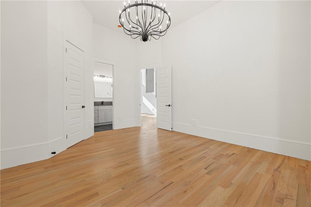 520 Heathmill Court Milton, GA 30004 - Photo 22 of 84 a view of empty room with wooden floor