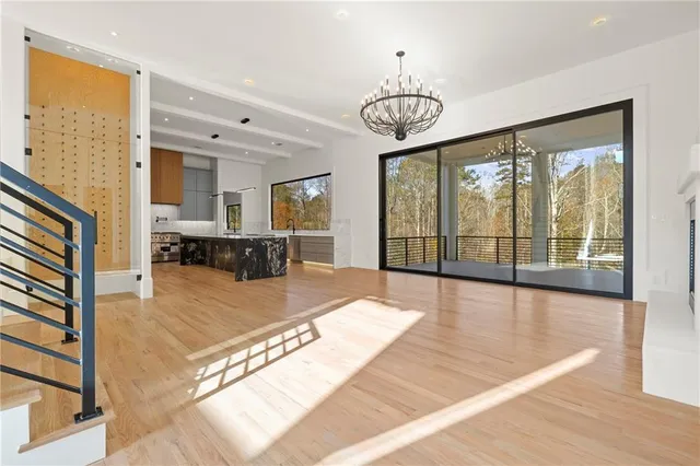 a kitchen with stainless steel appliances a stove a sink and a refrigerator