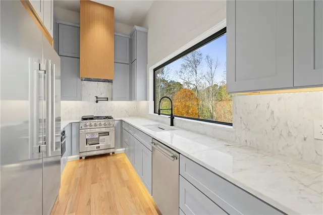 a view of living room with wooden floor and chandelier