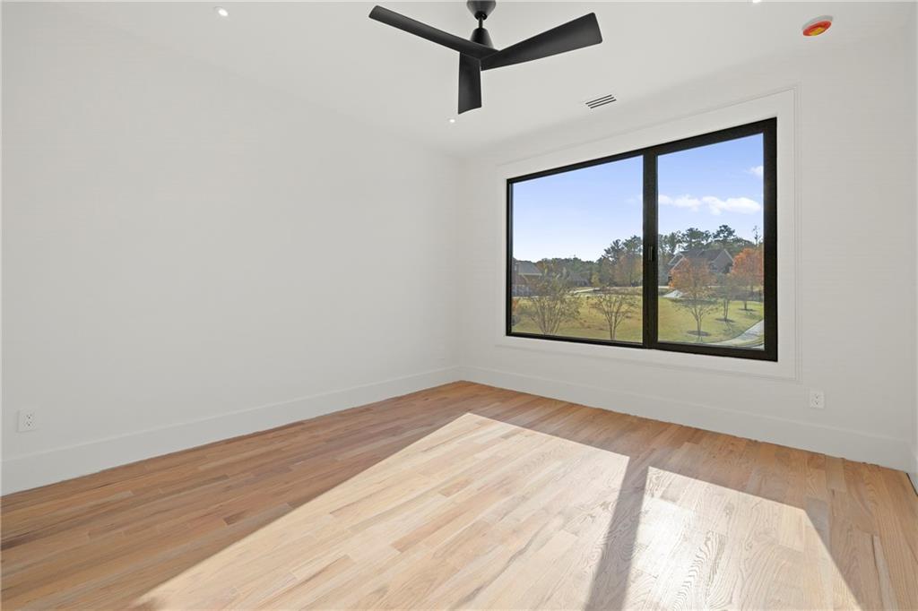 520 Heathmill Court Milton, GA 30004 - Photo 34 of 84 a view of a room with wooden floor and window