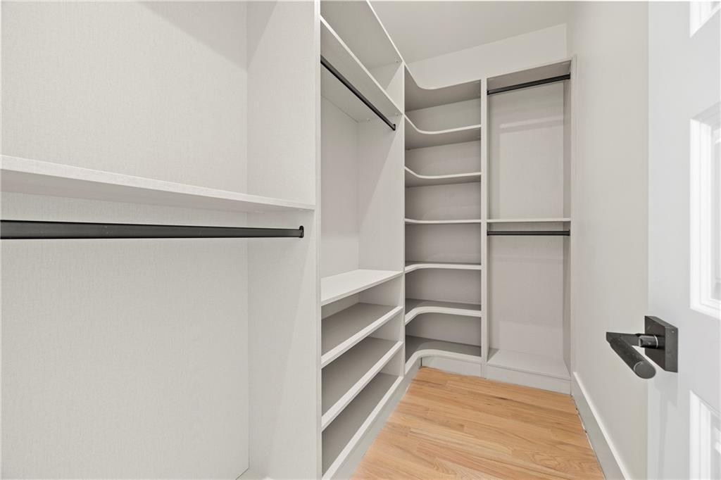 520 Heathmill Court Milton, GA 30004 - Photo 36 of 84 a view of walk in closet with empty racks