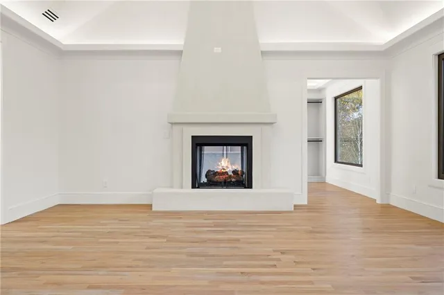 a view of a room with wooden floor