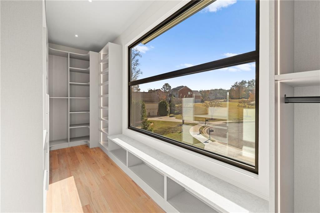 520 Heathmill Court Milton, GA 30004 - Photo 49 of 84 a view of a room with a large window and wooden floor