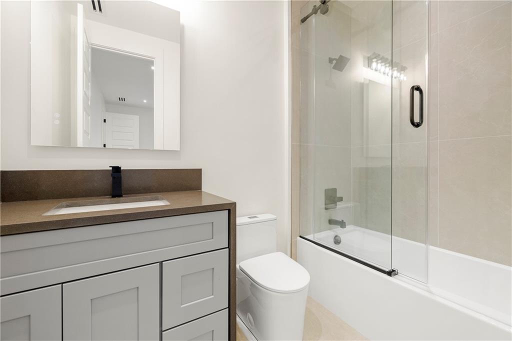 520 Heathmill Court Milton, GA 30004 - Photo 52 of 84 a bathroom with a sink a toilet and shower