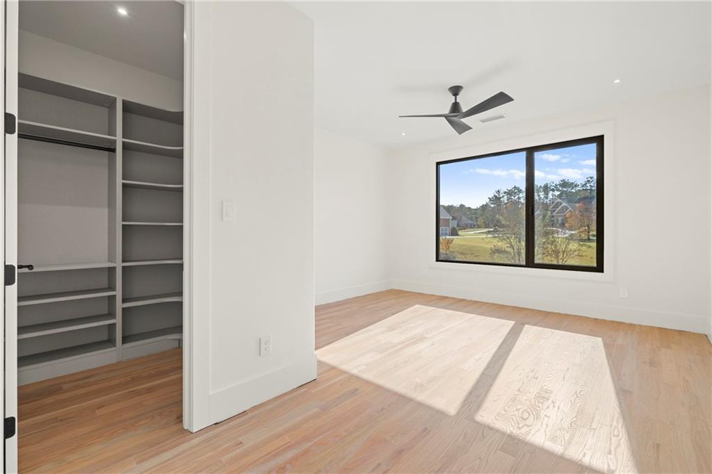 520 Heathmill Court Milton, GA 30004 - Photo 56 of 84 an empty room with wooden floor closet and windows