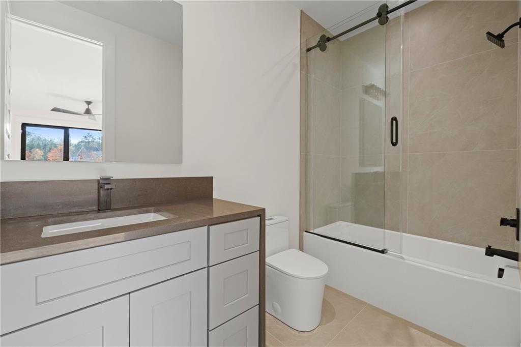 520 Heathmill Court Milton, GA 30004 - Photo 58 of 84 a bathroom with a sink a toilet and shower