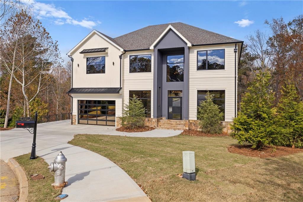 520 Heathmill Court Milton, GA 30004 - Photo 8 of 84 a front view of a house with a yard