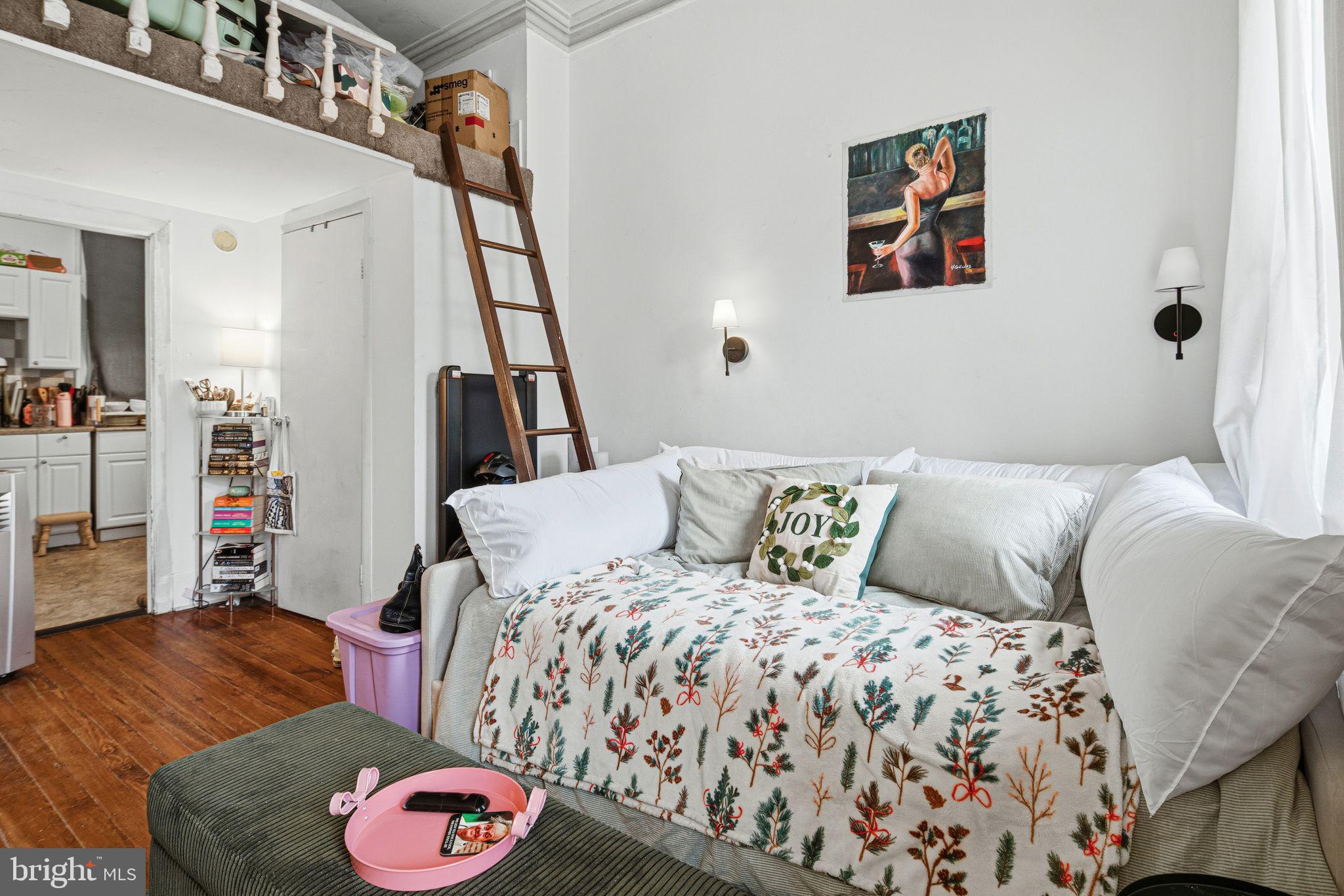 2914 Poplar Street Philadelphia, PA 19130 - Photo 13 of 32 a bedroom with a bed and a couch