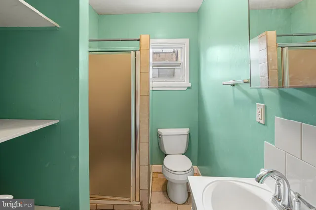 a bathroom with a toilet and a sink