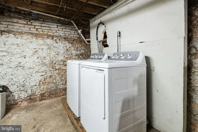 a utility room with a shower and cabinets