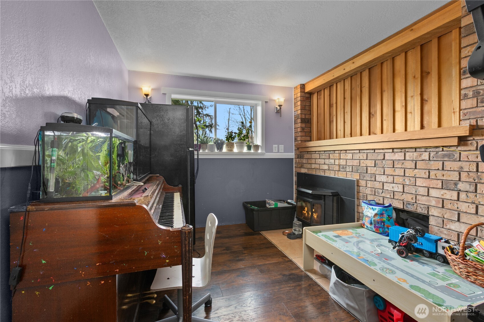 22731 Prairie Road Sedro-Woolley, WA 98284 - Photo 13 of 37 a dining room with furniture and a fireplace