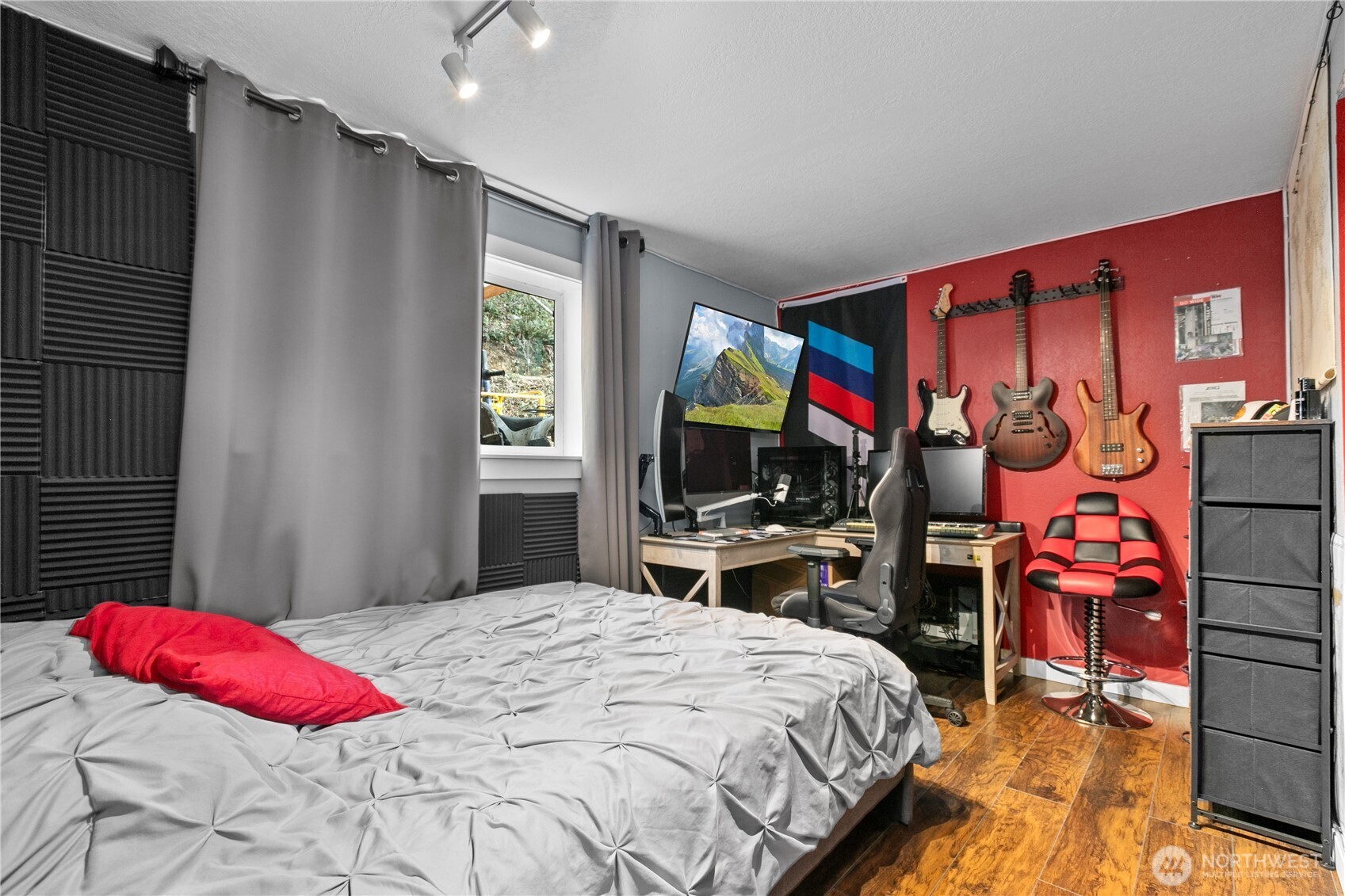 22731 Prairie Road Sedro-Woolley, WA 98284 - Photo 15 of 37 a bedroom with a bed dresser and a flat tv screen