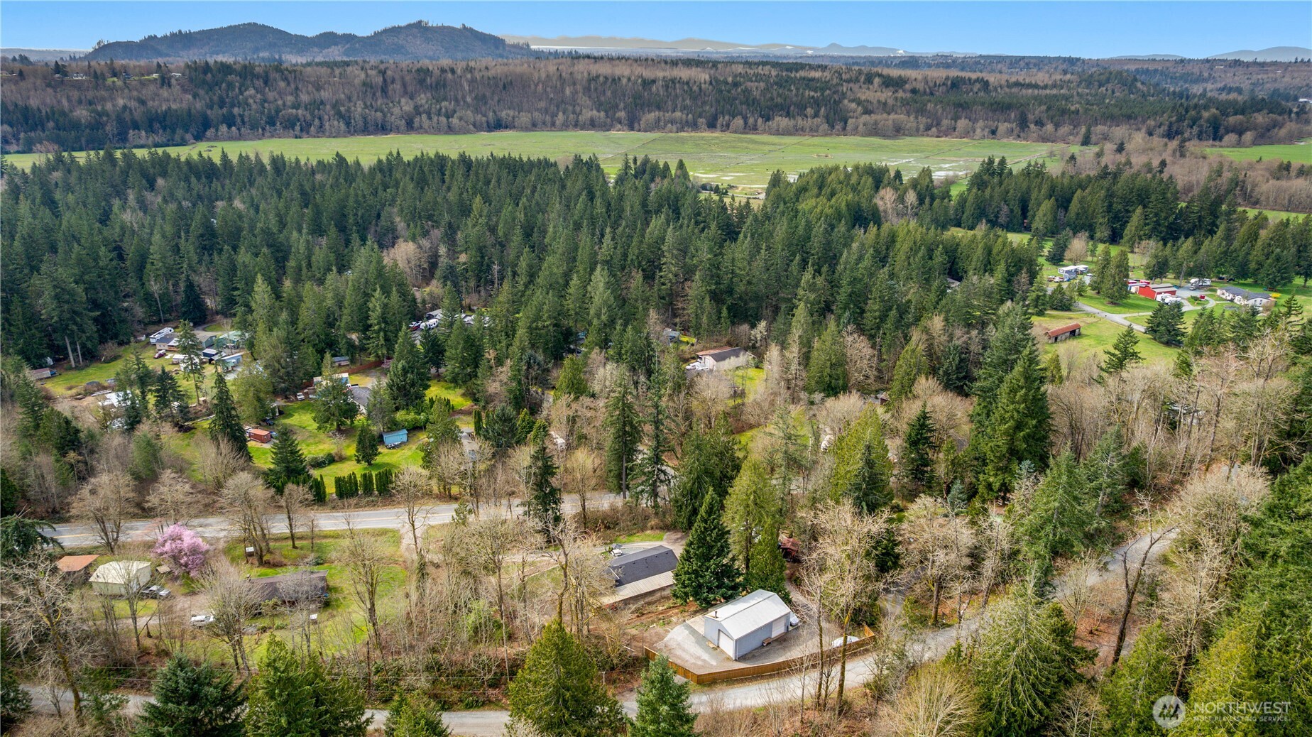 22731 Prairie Road Sedro-Woolley, WA 98284 - Photo 36 of 37 a view of a lush green hillside and houses