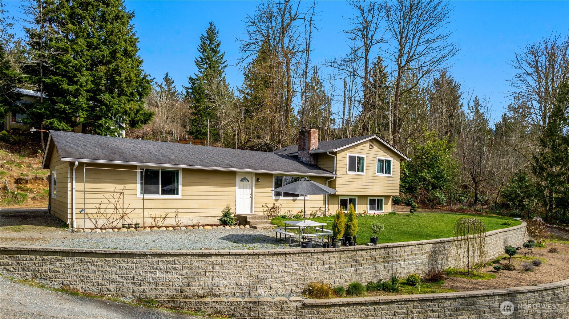 22731 Prairie Road Sedro-Woolley, WA 98284 - Photo 4 of 37 a front view of a house with a yard and trees