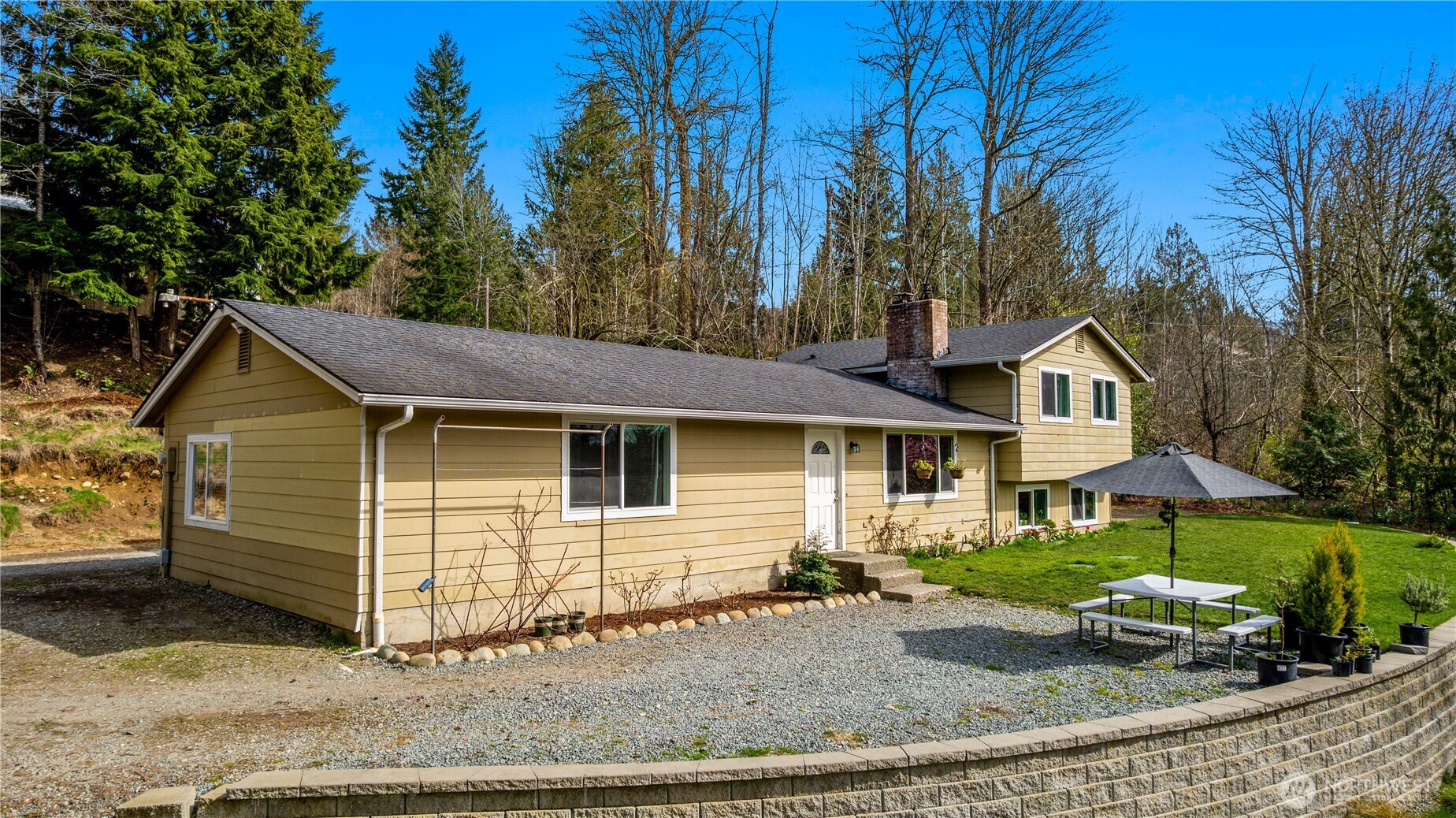 22731 Prairie Road Sedro-Woolley, WA 98284 - Photo 6 of 37 a view of a house with a yard