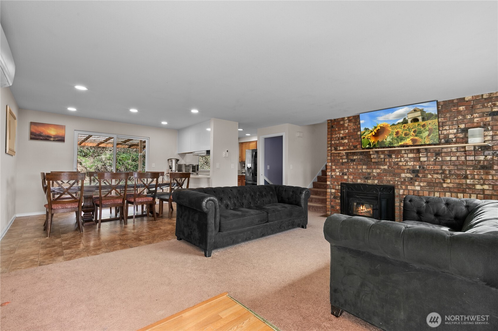 22731 Prairie Road Sedro-Woolley, WA 98284 - Photo 7 of 37 a living room with furniture a fireplace and a flat screen tv