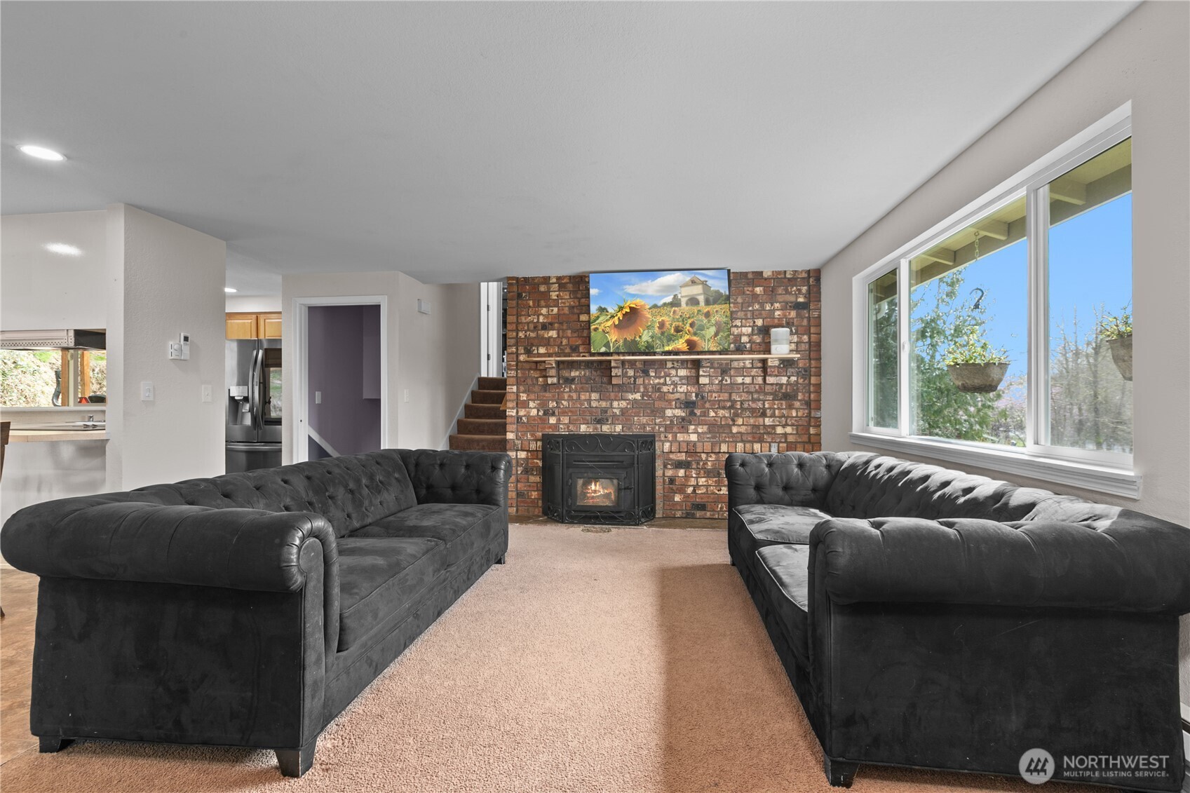 22731 Prairie Road Sedro-Woolley, WA 98284 - Photo 9 of 37 a living room with furniture and a fireplace