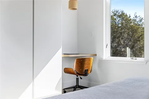 a kitchen with a table and chairs in it