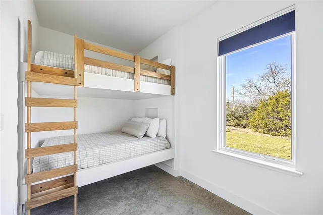 a kitchen with a stove a refrigerator and a table