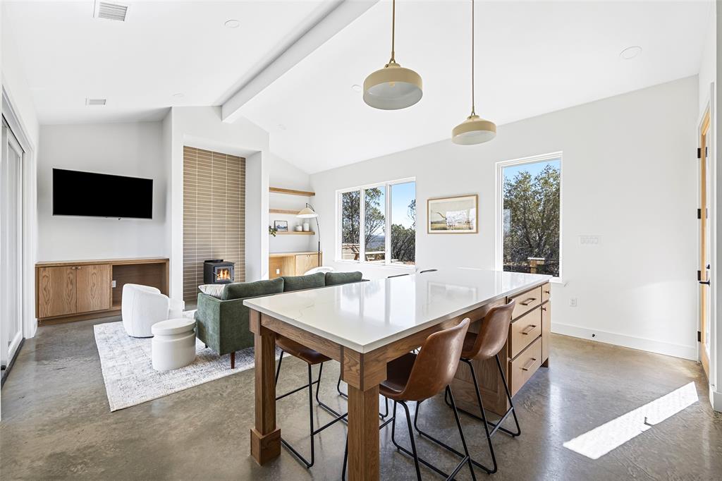 1166 Big Bear Loop Carbon, TX 76435 - Photo 17 of 39 a view of a dining room with furniture window and wooden floor