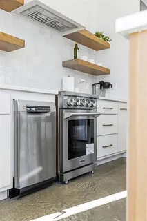 a kitchen that has a table and chairs in it