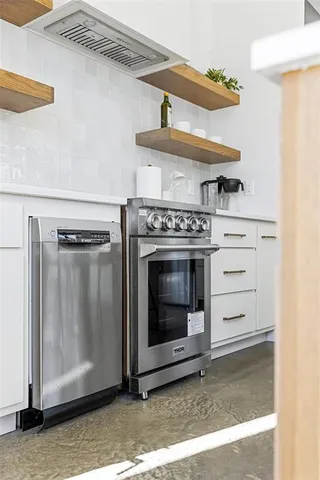 a kitchen that has a table and chairs in it