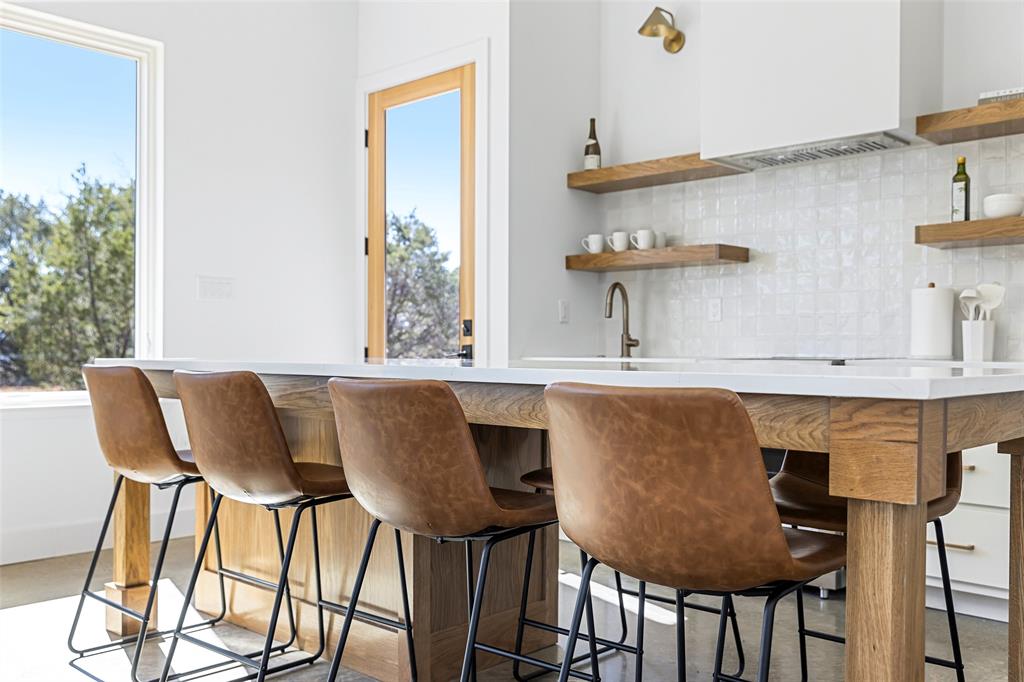 1166 Big Bear Loop Carbon, TX 76435 - Photo 20 of 39 a kitchen with a table and chairs in it