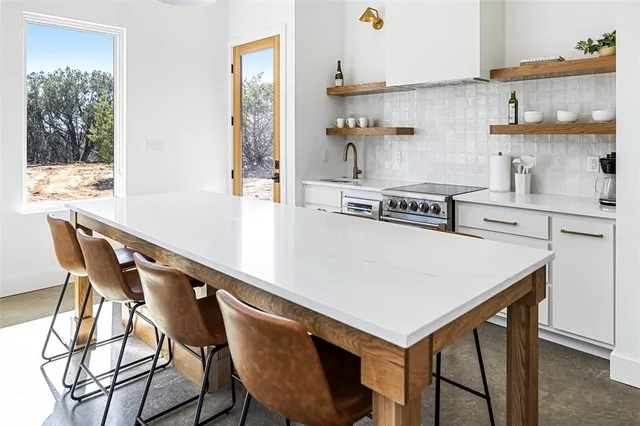 a bedroom with a bed and a table