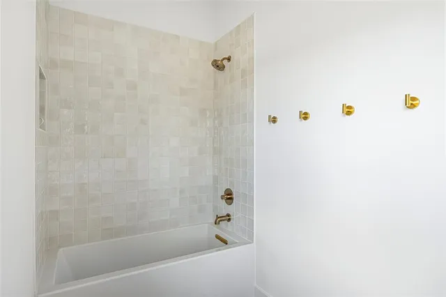 a view of a dining room with furniture and a flat screen tv
