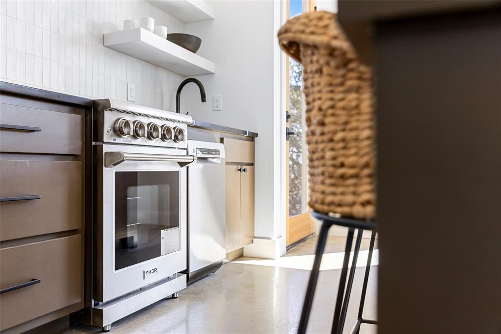 1166 Big Bear Loop Carbon, TX 76435 - Photo 25 of 39 a view of washer and dryer with bathroom in the background