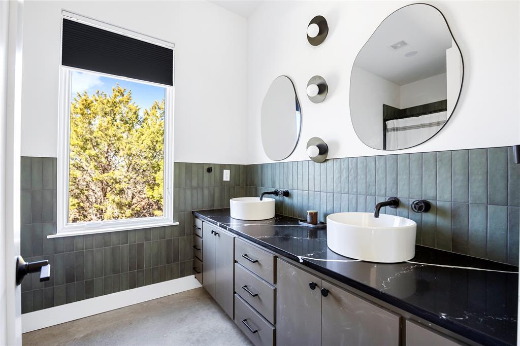 1166 Big Bear Loop Carbon, TX 76435 - Photo 30 of 39 a bathroom with a sink and a mirror