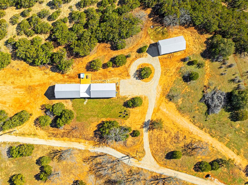 1166 Big Bear Loop Carbon, TX 76435 - Photo 7 of 39 a bathroom with a sink and mirror