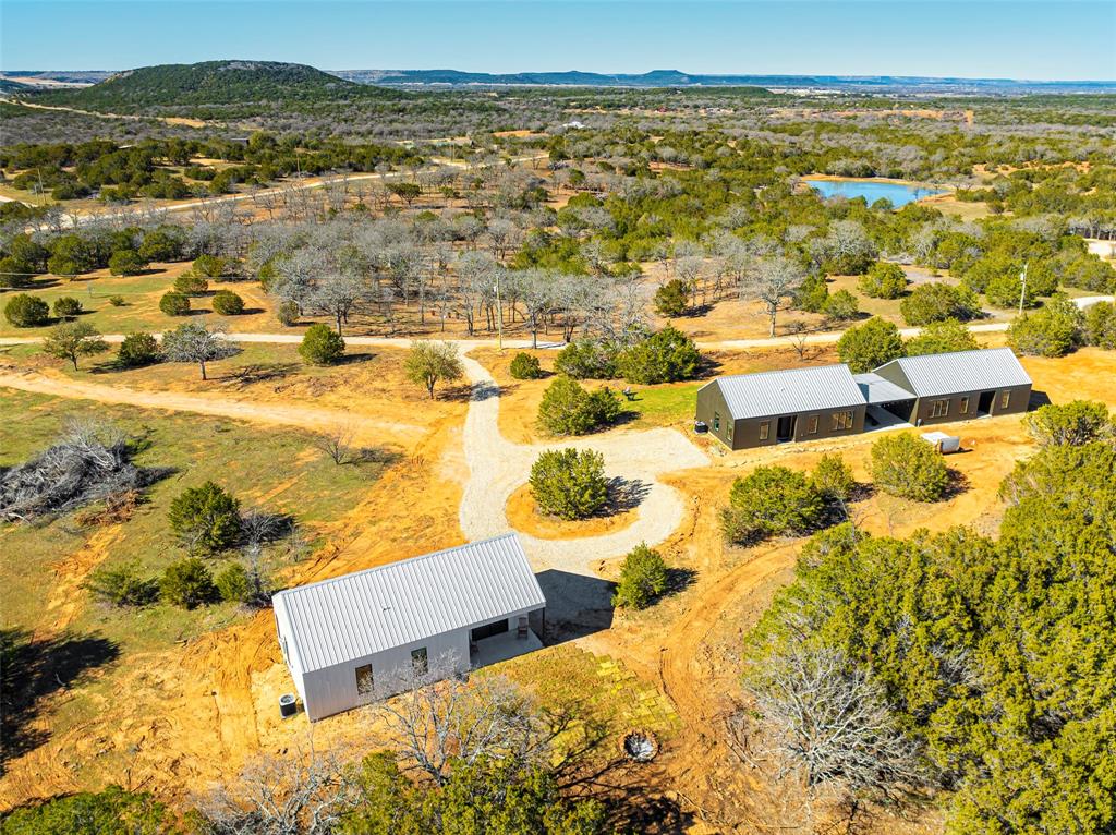 1166 Big Bear Loop Carbon, TX 76435 - Photo 8 of 39 an aerial view of residential houses with outdoor space