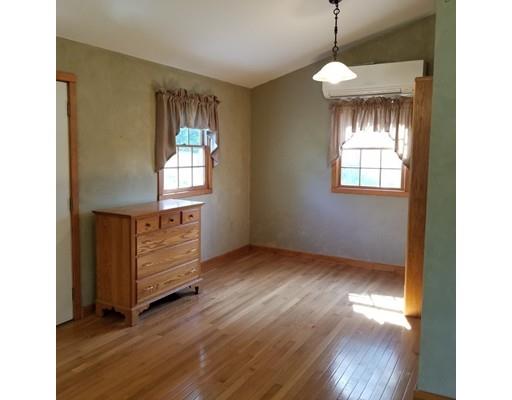 142 Barre Road Hardwick, MA 01037 - Photo 12 of 28 a view of an empty room with wooden floor and a window