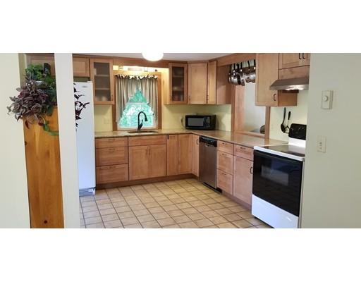 142 Barre Road Hardwick, MA 01037 - Photo 7 of 28 a kitchen with stainless steel appliances granite countertop a stove a sink and a refrigerator