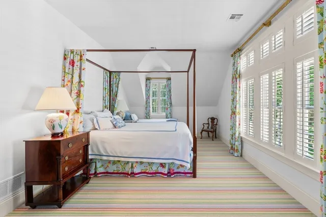 a bed room with a bed and a window