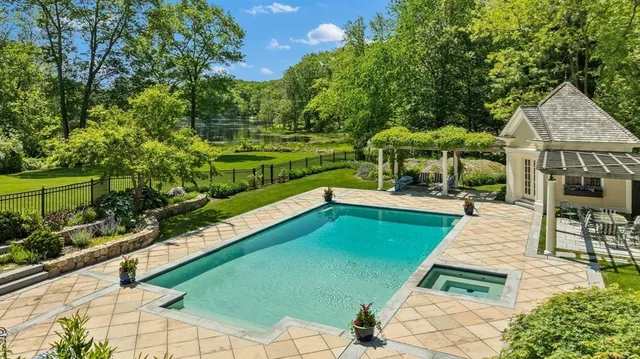a view of a swimming pool with a patio