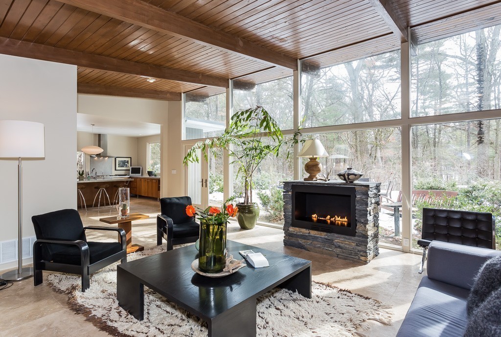 111 Captain Road Longmeadow, MA 01106 - Photo 1 of 30 a living room with furniture a fireplace and a large window