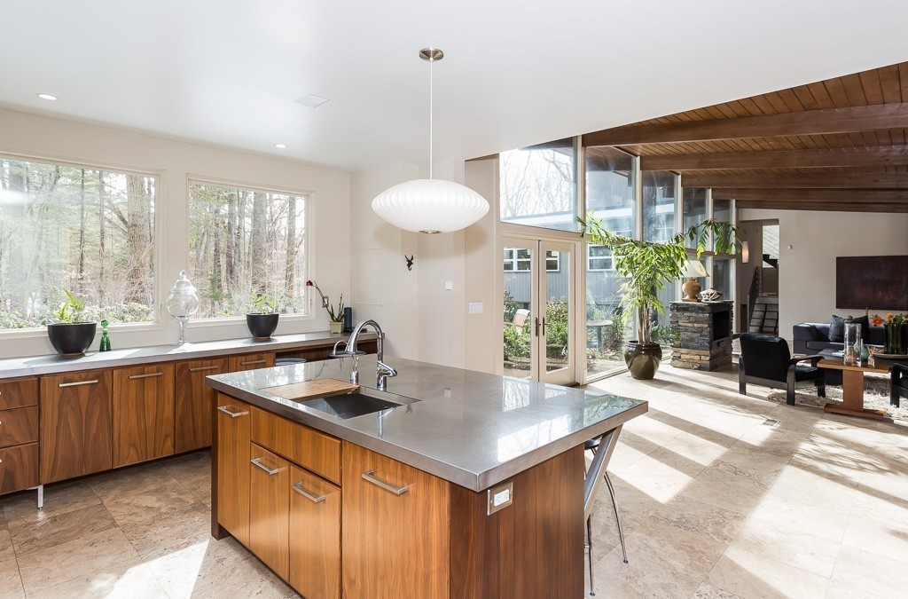 111 Captain Road Longmeadow, MA 01106 - Photo 11 of 30 a kitchen with stainless steel appliances granite countertop a sink a counter space and living room view