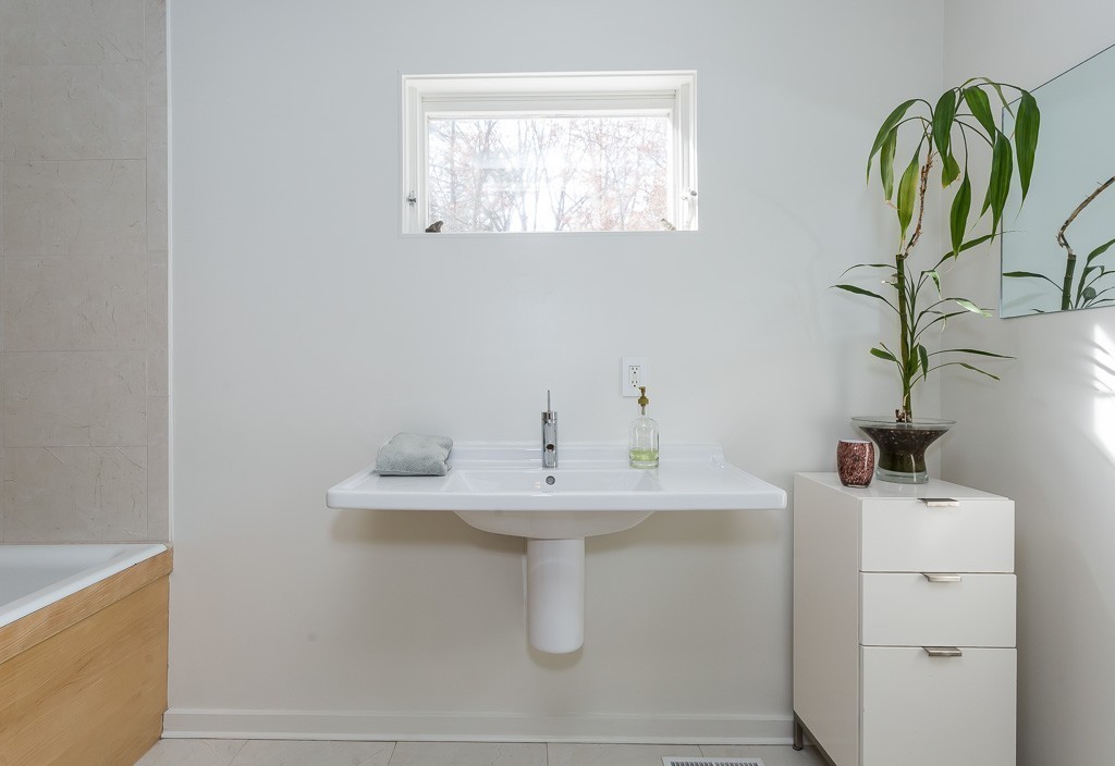 111 Captain Road Longmeadow, MA 01106 - Photo 18 of 30 a bathroom with a sink a mirror and a window