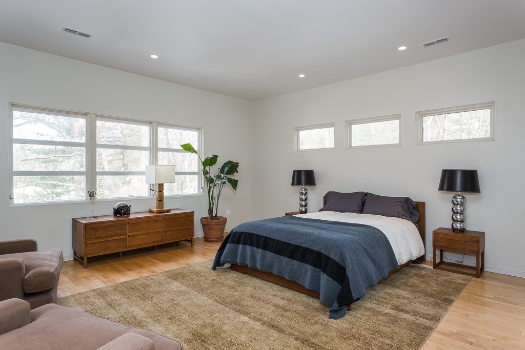 111 Captain Road Longmeadow, MA 01106 - Photo 20 of 30 a bedroom with a bed and a couch