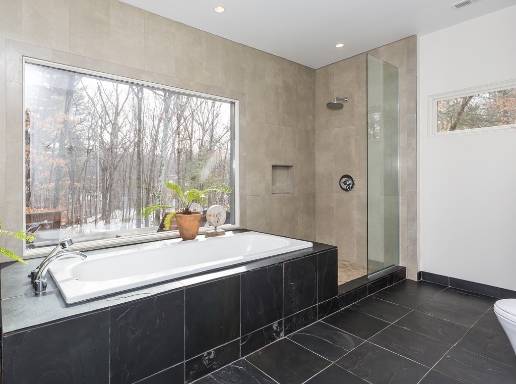 111 Captain Road Longmeadow, MA 01106 - Photo 23 of 30 a bathroom with a double vanity sink and a large mirror