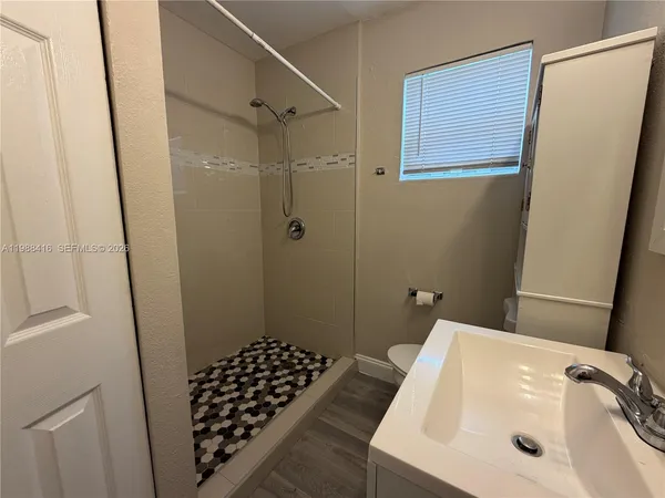 a bathroom with a sink and a shower