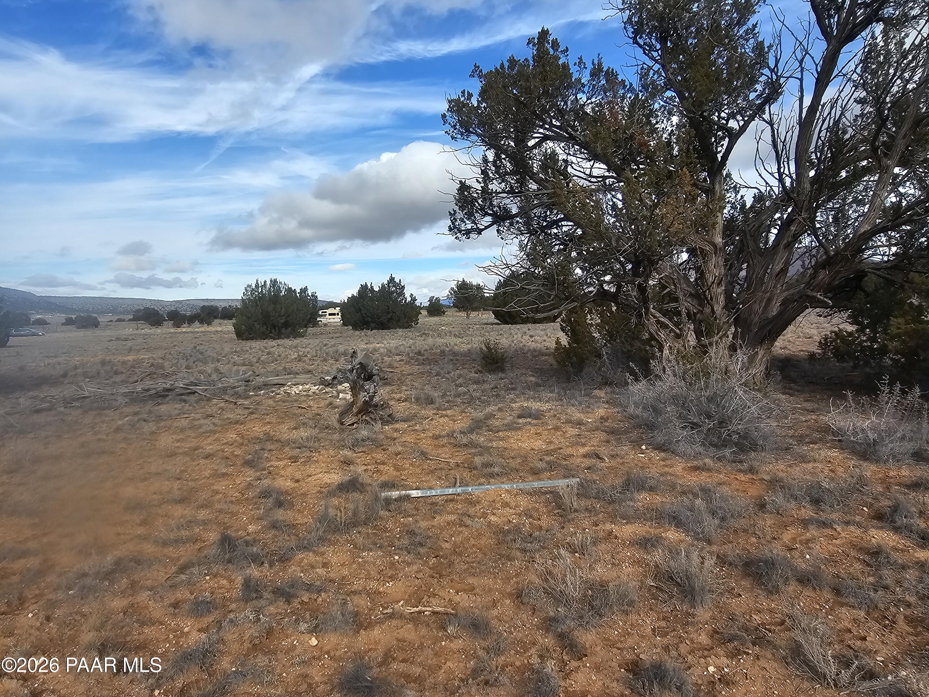 27565 Fort Rock Road Seligman, AZ 86337 - Photo 12 of 14 a view of a dry yard with wooden fence